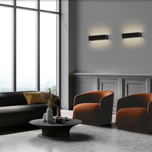 Applique murale Icon au design compact et épuré, combinant lumière directe et indirecte pour un éclairage harmonieux et fluide, idéale pour sublimer couloirs et chambres avec élégance discrète.