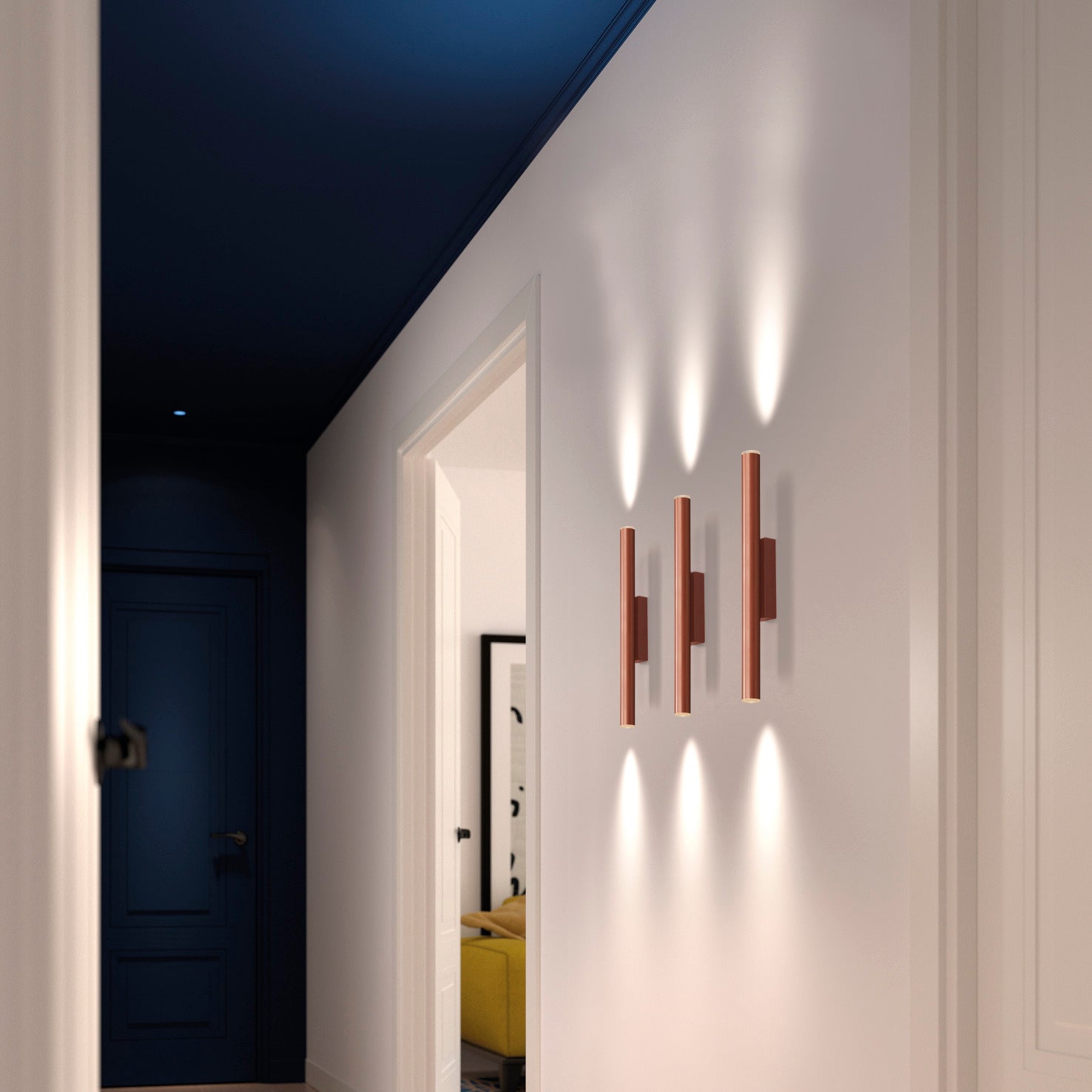 Applique murale LED cylindrique couleur cuivre de la famille Tania, diffusant une lumière chaude et homogène idéale pour un salon ou une chambre moderne.