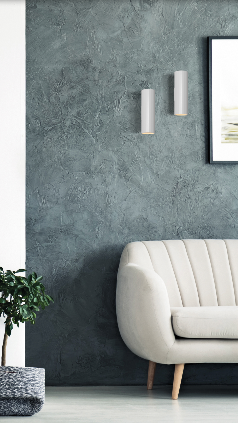 Applique murale double faisceau au design cylindrique et minimaliste, diffusant une lumière douce vers le haut et le bas pour créer une ambiance chaleureuse et équilibrée dans tous vos espaces intérieurs.