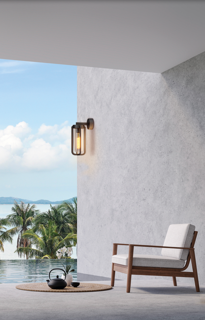 Applique murale extérieure Vega en finition anthracite texturée, design intemporel et élégant, diffusant une lumière douce et chaleureuse idéale pour terrasses, allées et entrées.