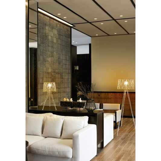 Lampe de table design Tess T en acier blanc diffusant une lumière douce et apaisante, idéale pour salon, chambre ou bureau moderne.