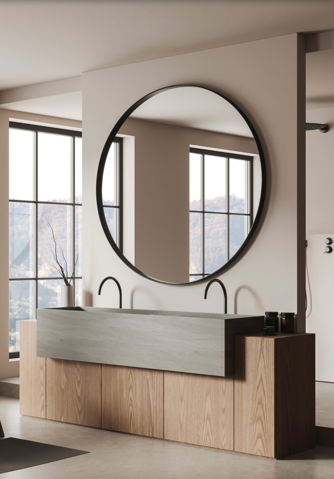 Miroir Olbia rond avec bordure noire, design épuré et moderne, apportant lumière et profondeur à la salle de bains ou à tout intérieur, disponible en plusieurs tailles.