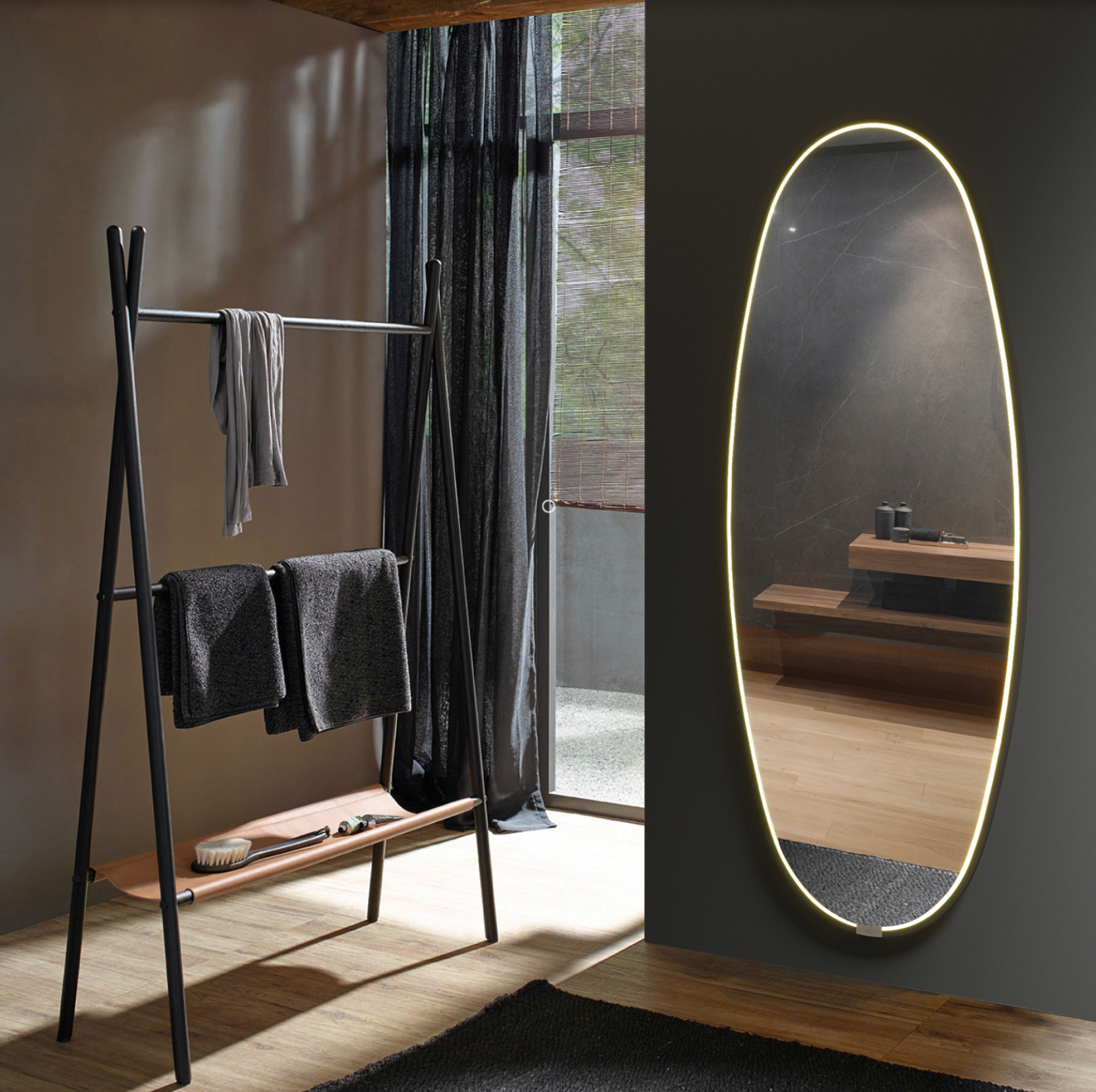 Miroir Onix ovale avec éclairage LED intégré et cadre noir, design moderne et élégant, diffusant une lumière douce et décorative idéale pour salon, chambre ou dressing.