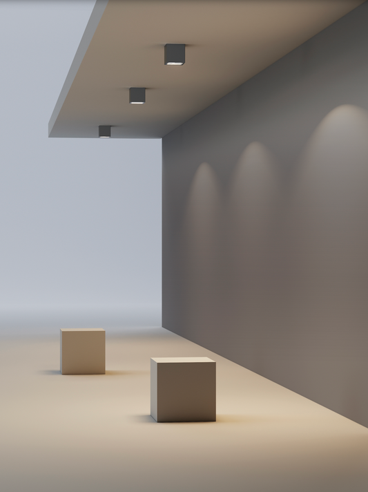 Plafonnier extérieur Perseo en finition gris ciment, design brut et raffiné, diffusant une lumière chaude et naturelle idéale pour terrasses et entrées, résistant aux intempéries.