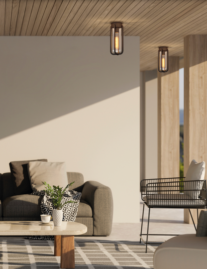 Plafonnier extérieur Vega en finition anthracite texturée, design sobre et moderne, diffusant une lumière douce et homogène idéale pour terrasses, porches et pergolas.