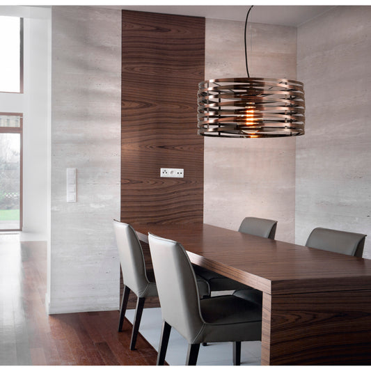 Suspension Sira en métal noir (ou blanc), au design ajouré et contemporain, idéale pour salon, salle à manger ou chambre, offrant un éclairage doux et raffiné.